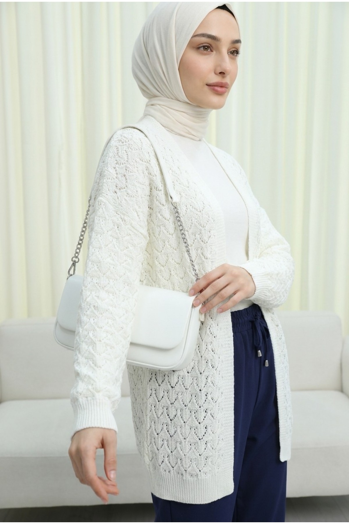 Loose-fitting knitted cardigan with openwork pattern. -Ecru