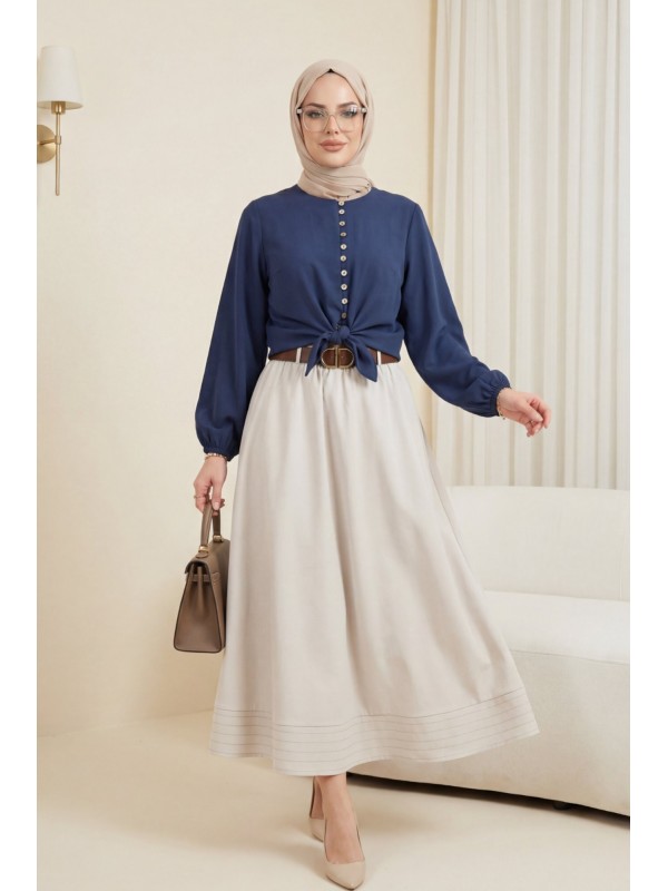 قميص من قماش المودال بحافة قابلة للربط، وخصر وأساور مطاطية، وإغلاق بأزرار. -كحلي