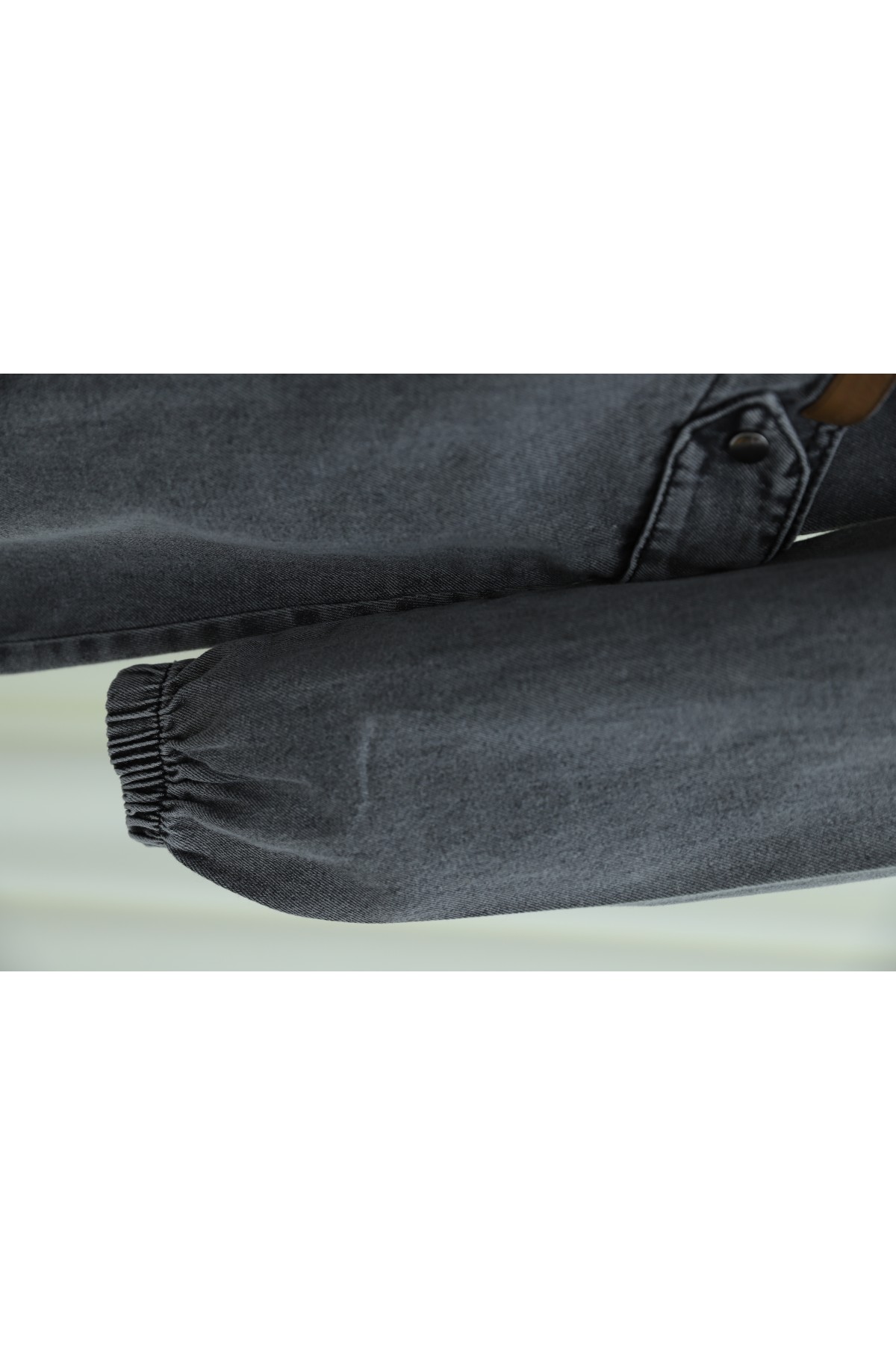 Hooded denim jacket with pockets, elasticated cuffs, and front zip closure.  -Smoked 