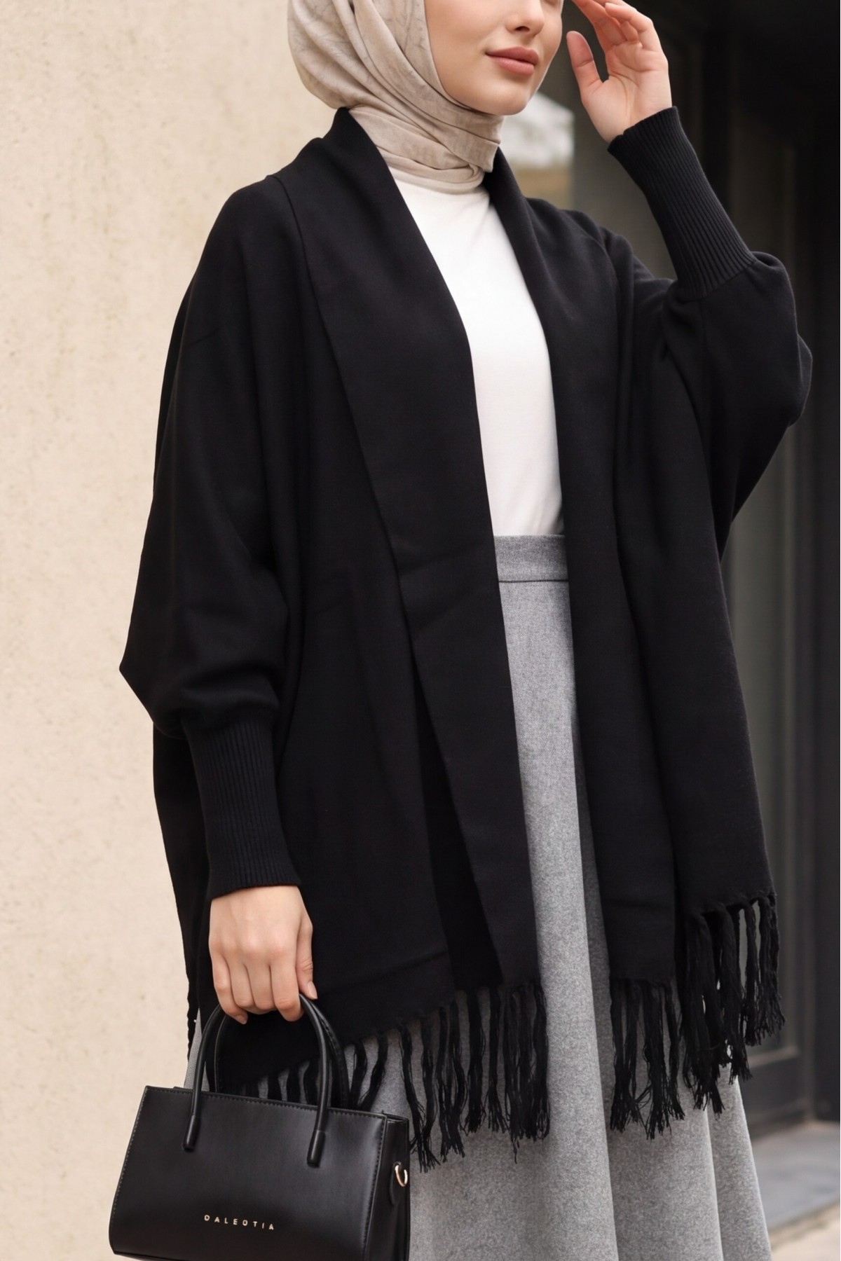 Knit Poncho with Tassel-Trimmed Sleeve Cuffs -Black