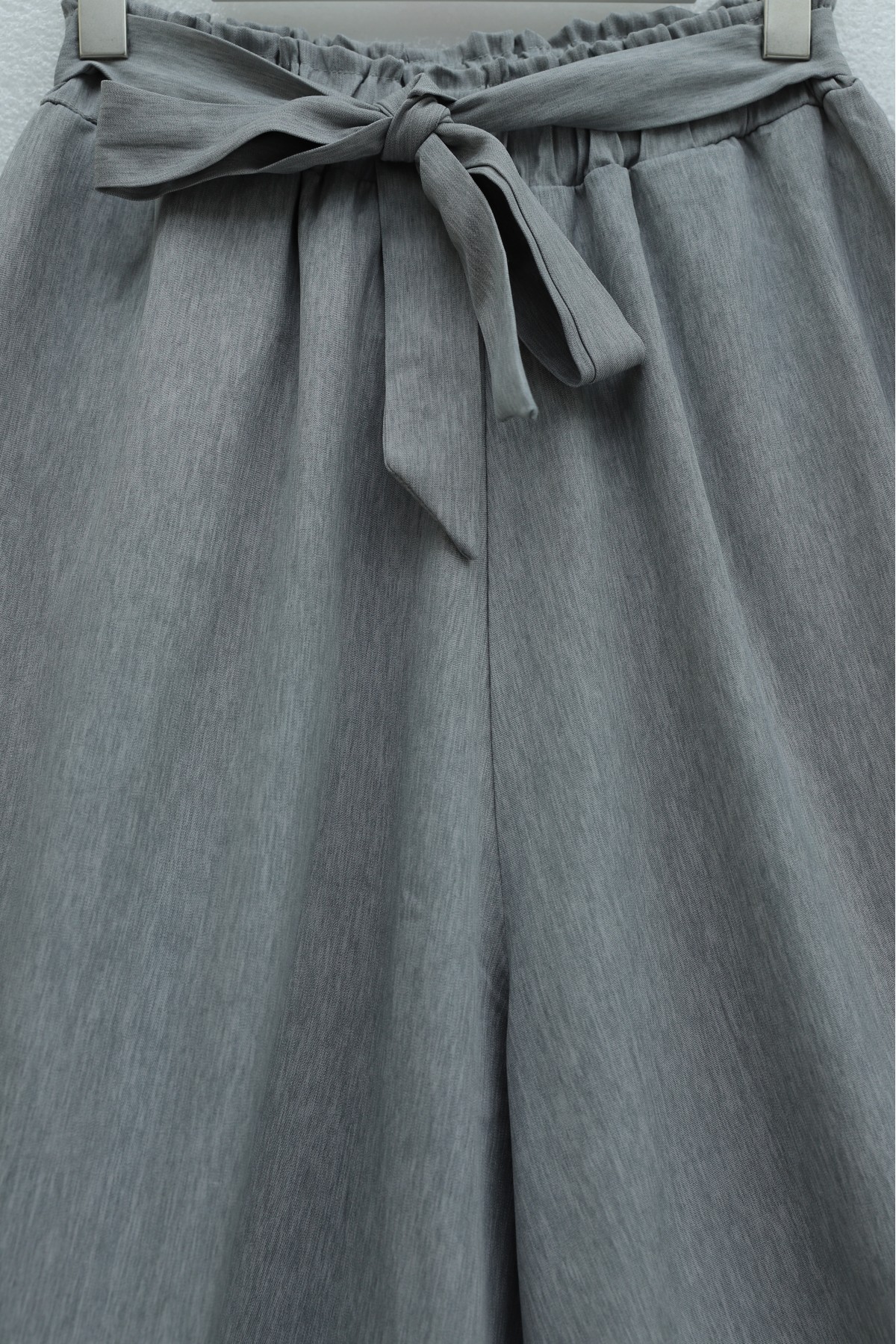 Linen-look skirt/pants with elasticated waist, belt, and pockets. -Grey