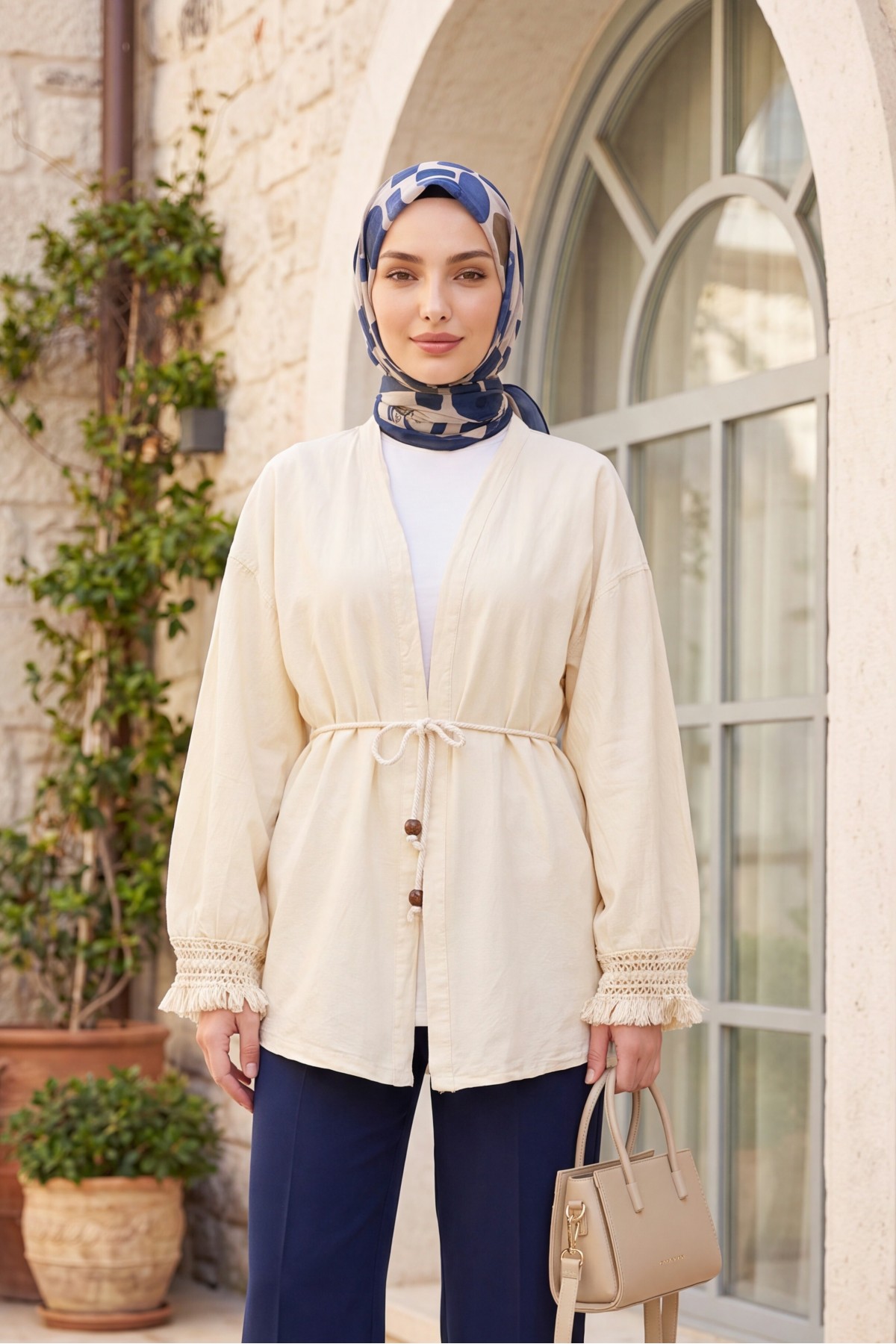 Linen-look kimono with lace tassel cuffs and drawstring waist. -Cream color