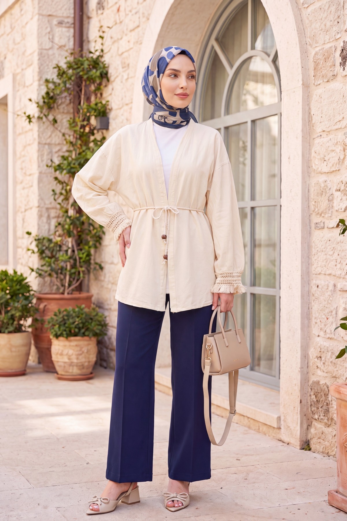 Linen-look kimono with lace tassel cuffs and drawstring waist. -Cream color