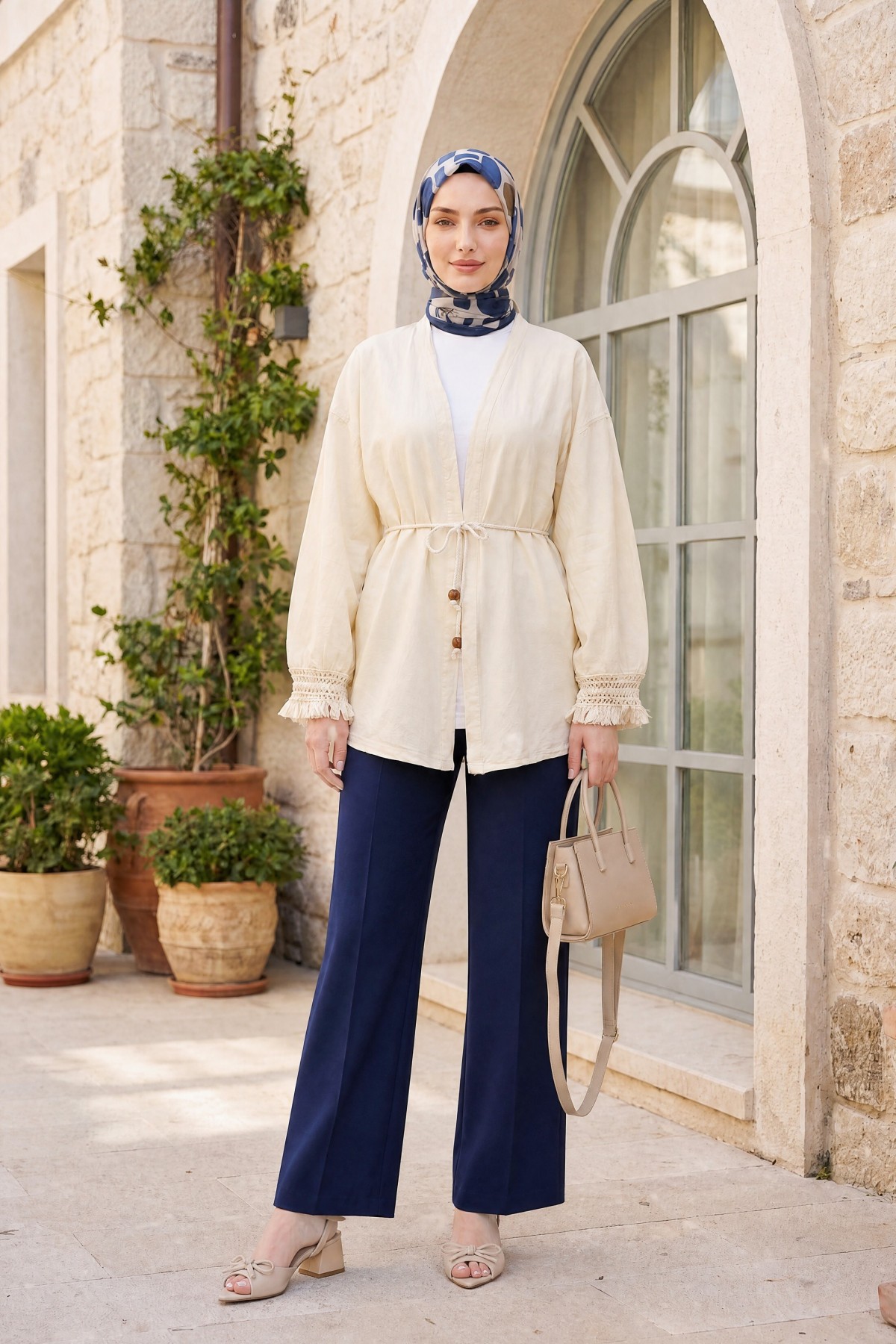 Linen-look kimono with lace tassel cuffs and drawstring waist. -Cream color