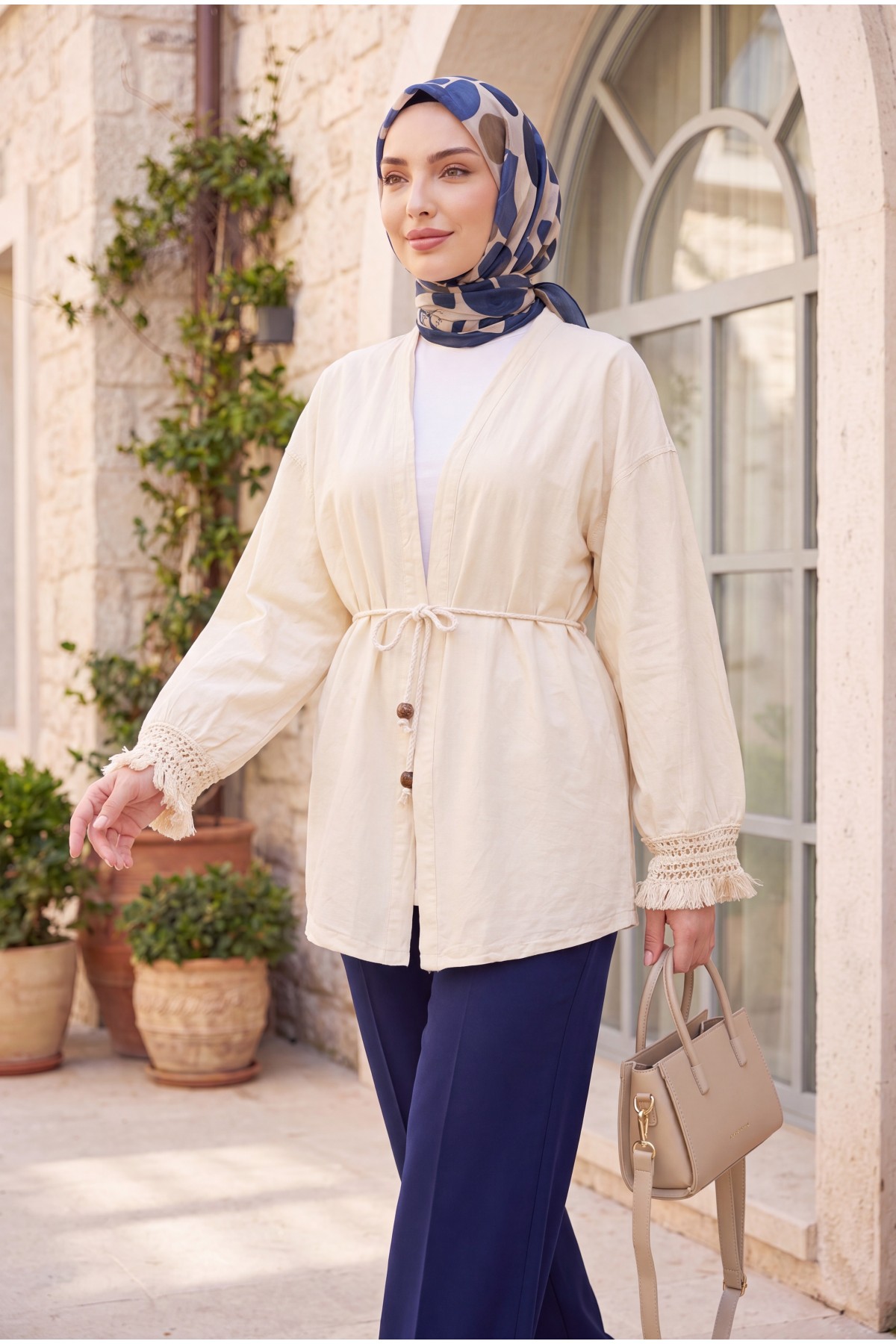 Linen-look kimono with lace tassel cuffs and drawstring waist. -Cream color