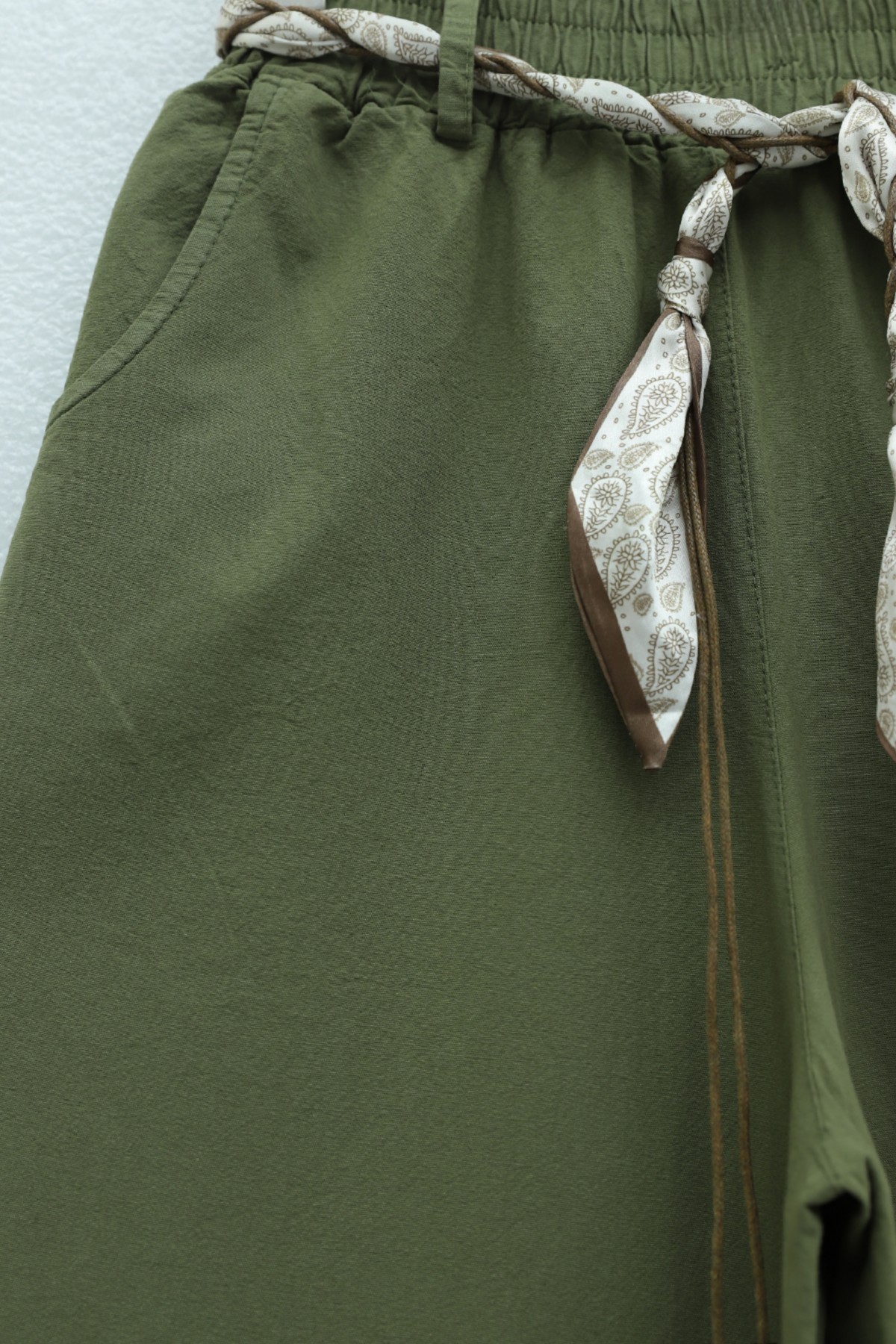 Wide-leg linen trousers with elasticated waist, belt, and pockets. -Khaki
