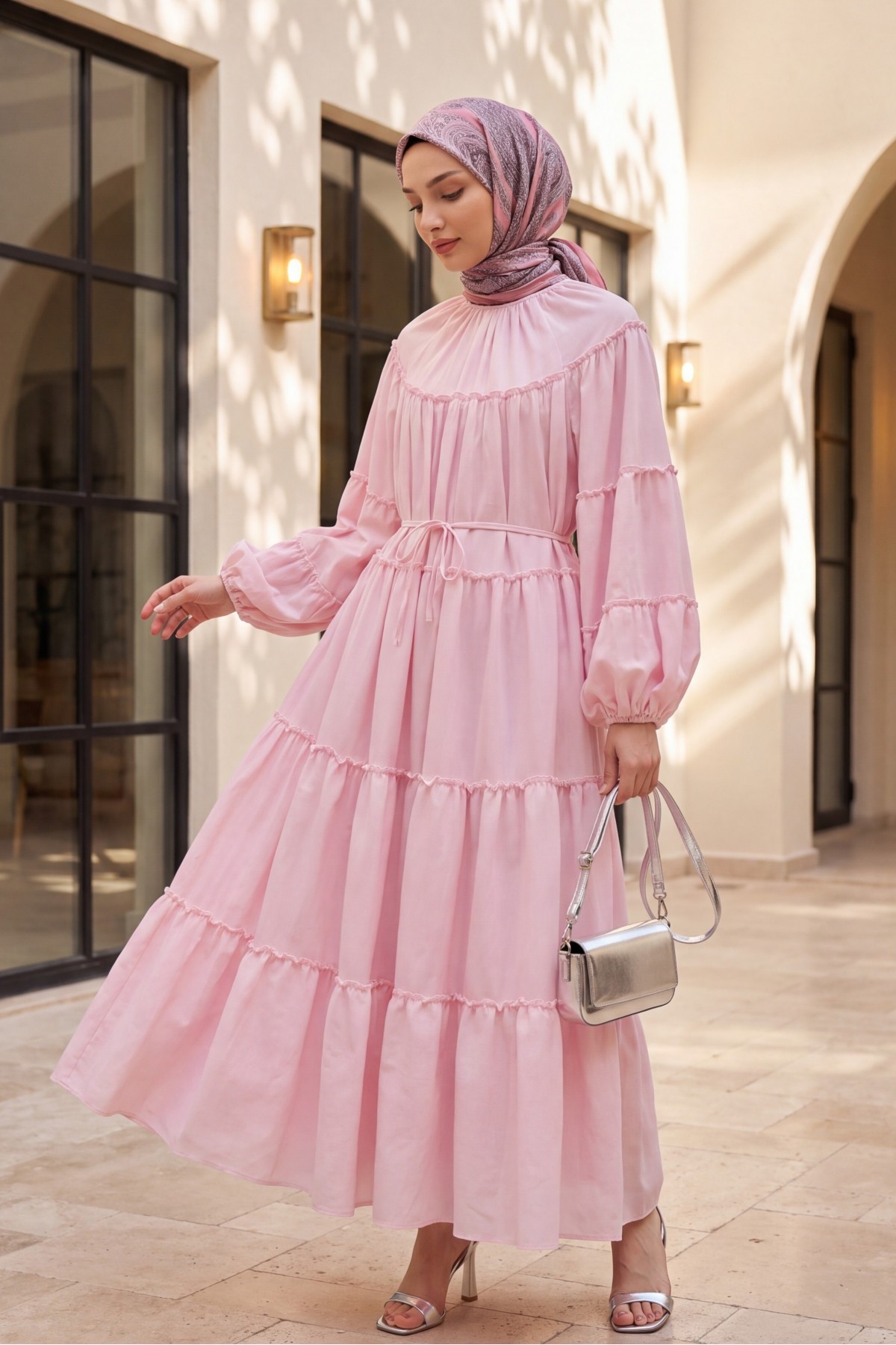 Layered ruffle detailed dress with elasticated sleeves and tie-waist.