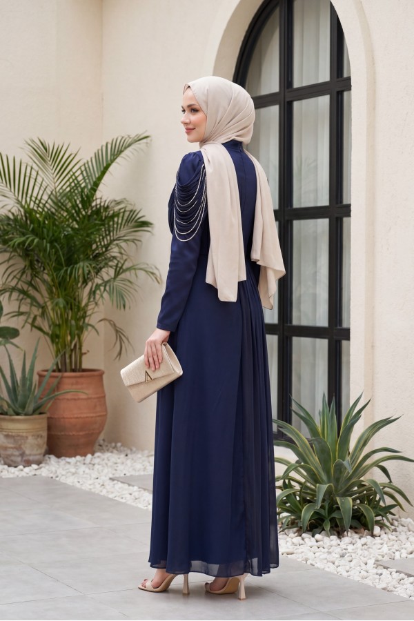 Front-facing, shoulder-embellished, shimmering chiffon detail satin evening gown. -Navy blue
