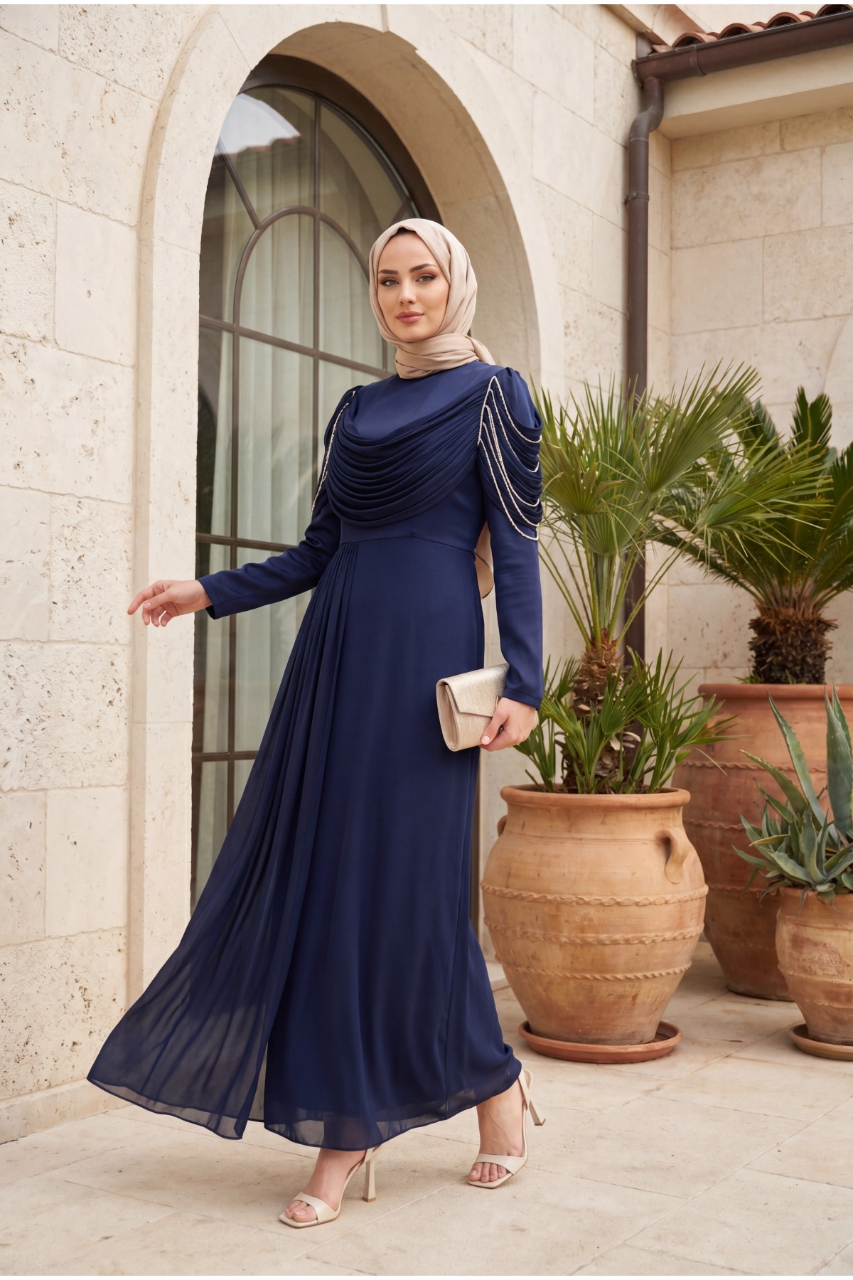Front-facing, shoulder-embellished, shimmering chiffon detail satin evening gown. -Navy blue