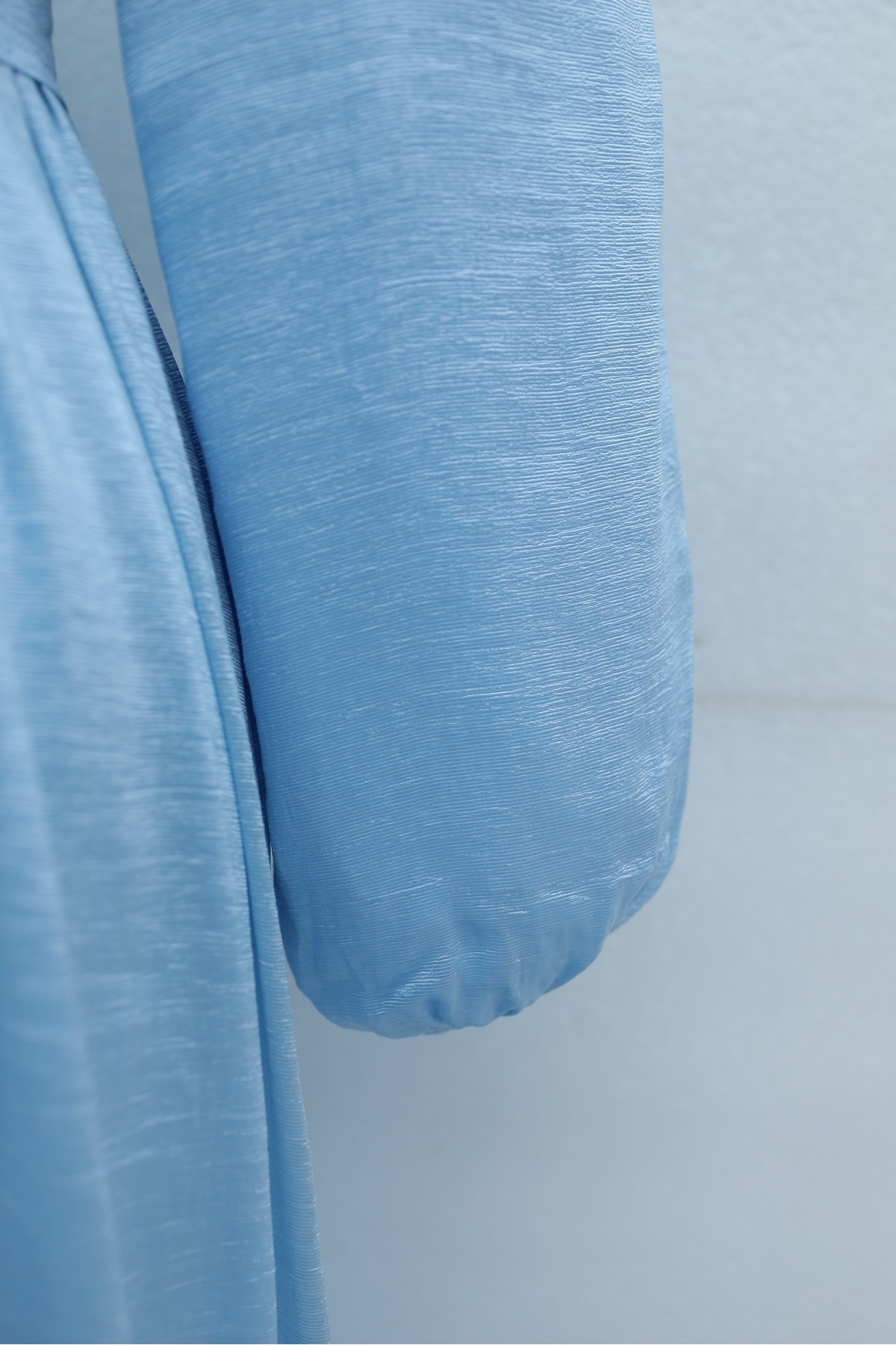 Long dress with ruffled neckline and hem, elasticated sleeves, crinkle crepe lining. -Baby Blue