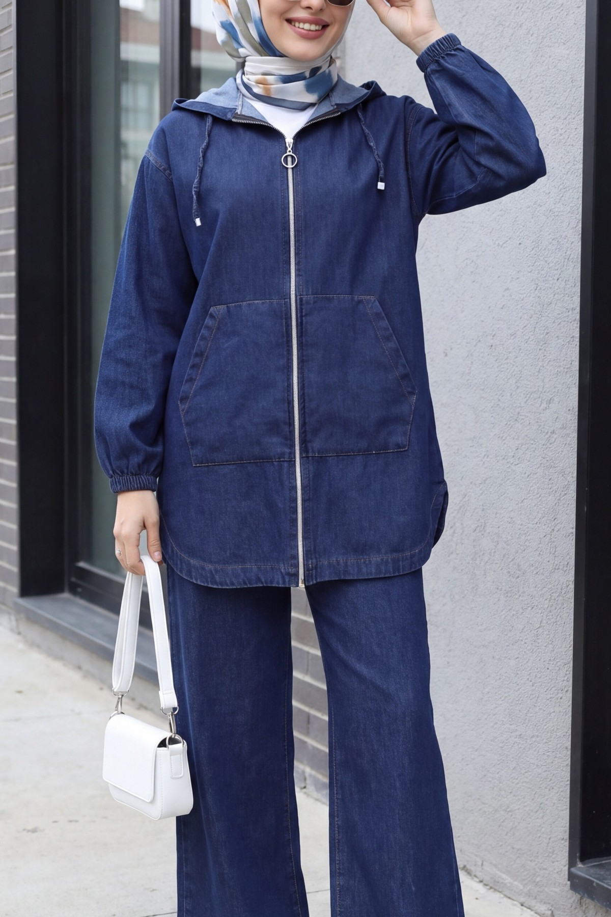 Hooded denim suit with front zip, elasticated cuffs, and pockets.  -Navy blue