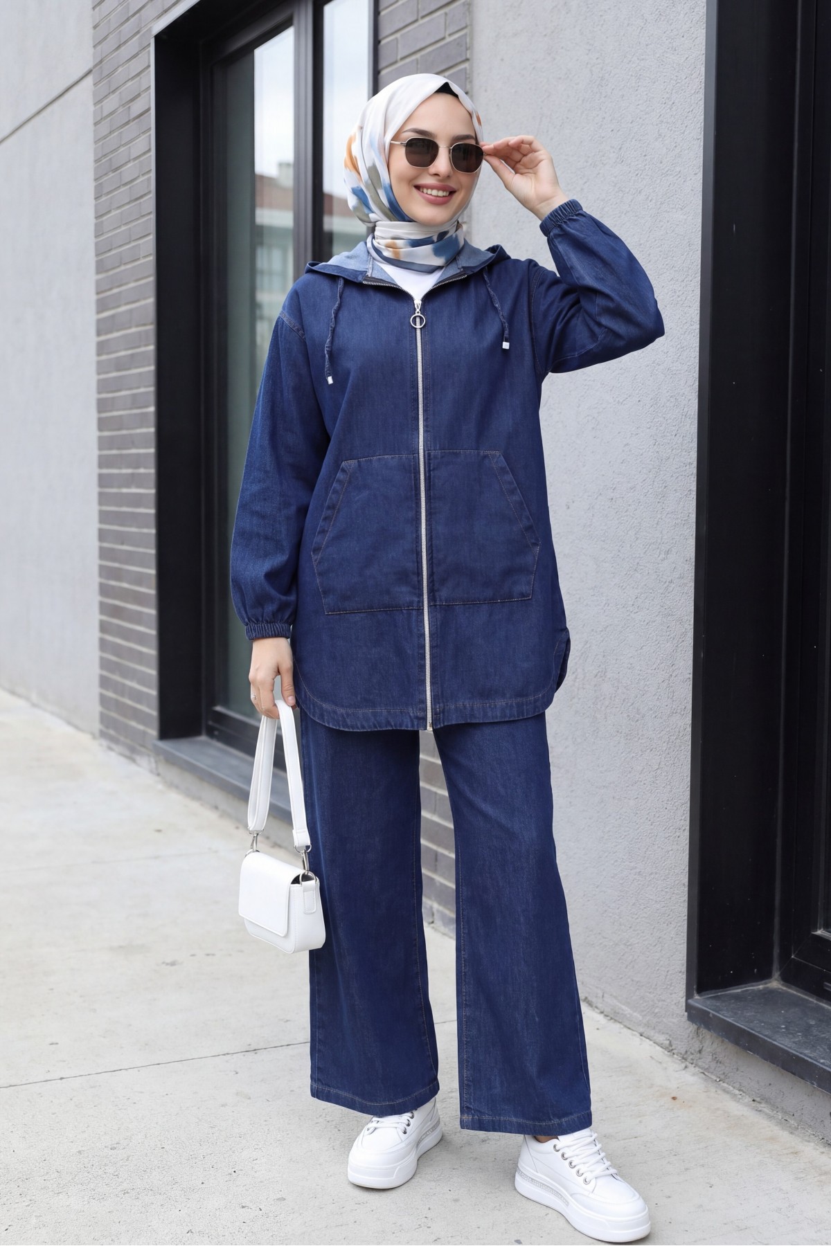 Hooded denim suit with front zip, elasticated cuffs, and pockets.  -Navy blue