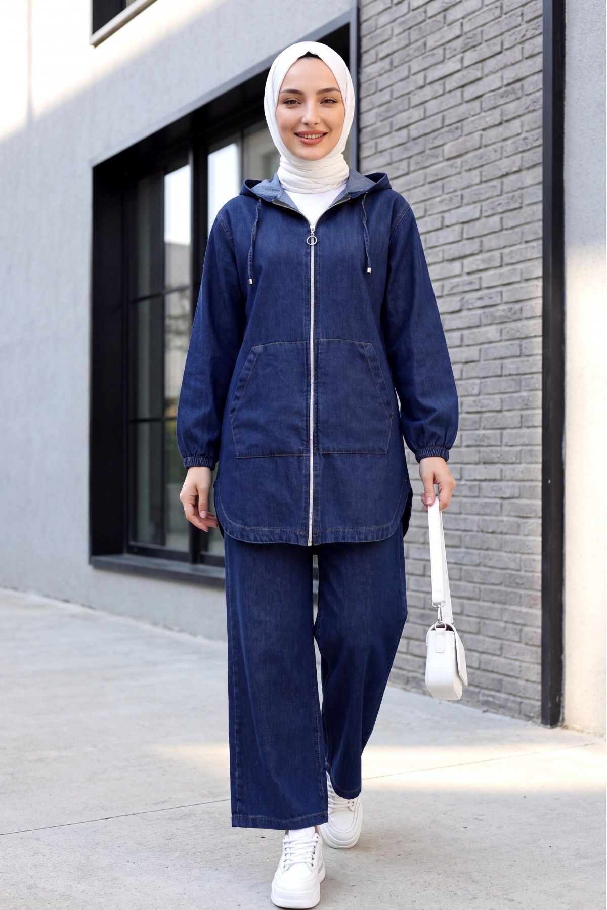 Hooded denim suit with front zip, elasticated cuffs, and pockets.  -Navy blue