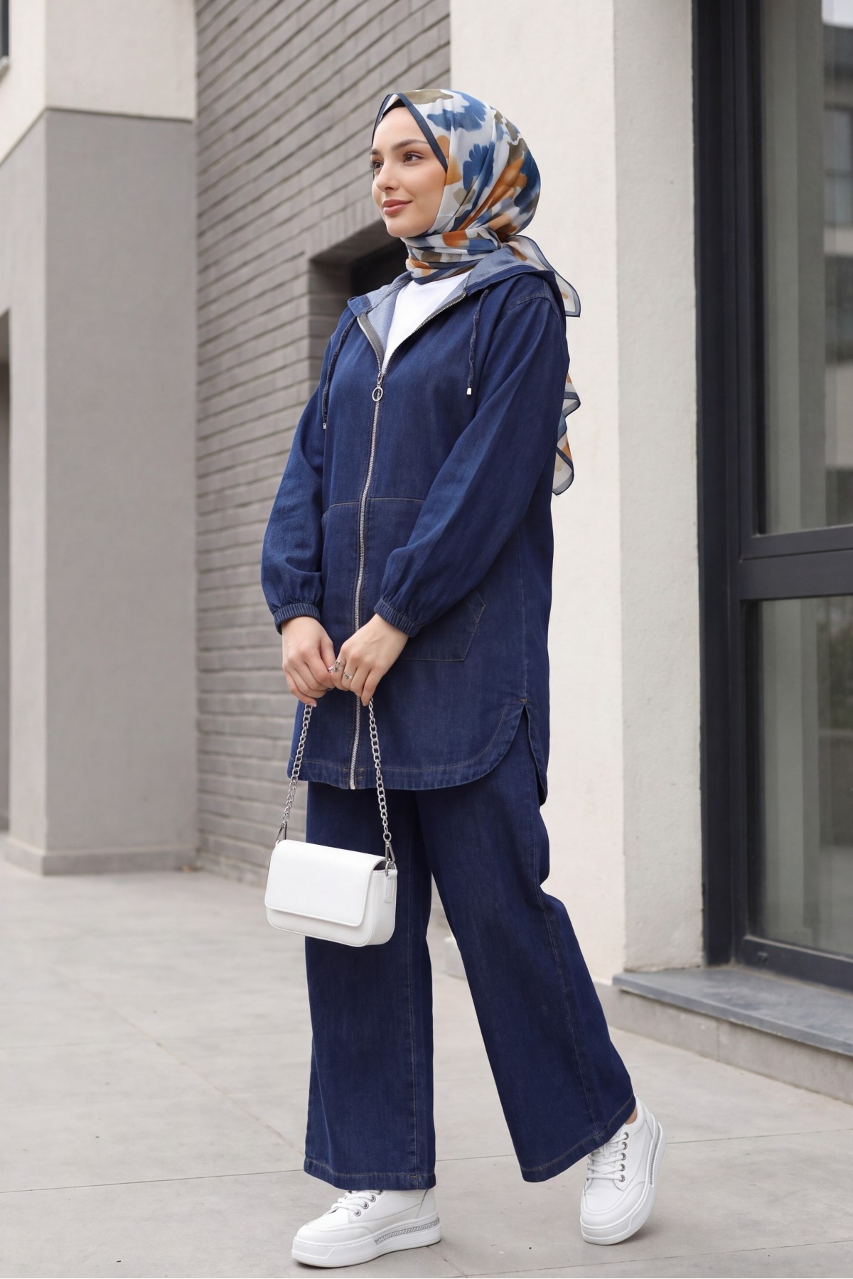 Hooded denim suit with front zip, elasticated cuffs, and pockets.  -Navy blue