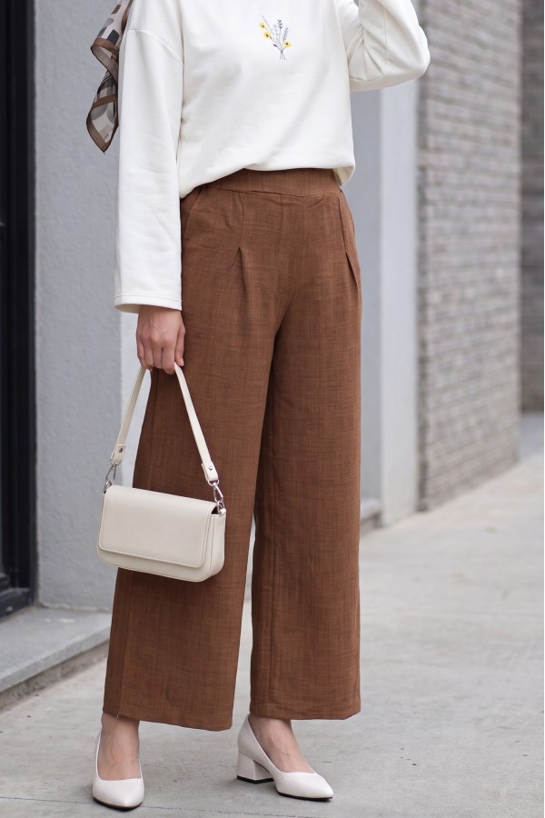 Wide-leg pleated linen-look trousers with elasticated waist. -Brown