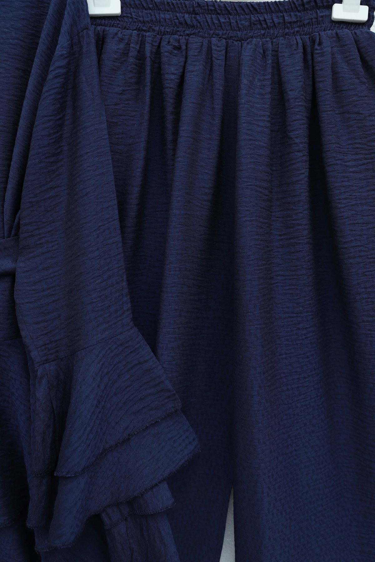 Jacquard Waffle Suit with Ruffled Cuffs and Wide Leg Trousers, and Belt. -Navy blue