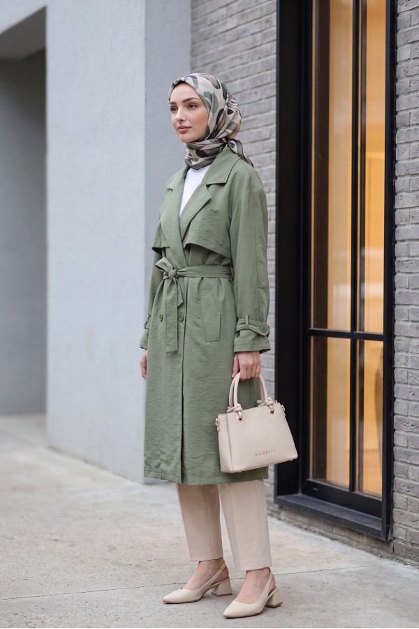 Trench coat made of polyester fabric with belt, pockets, and epauletted sleeves. -Khaki