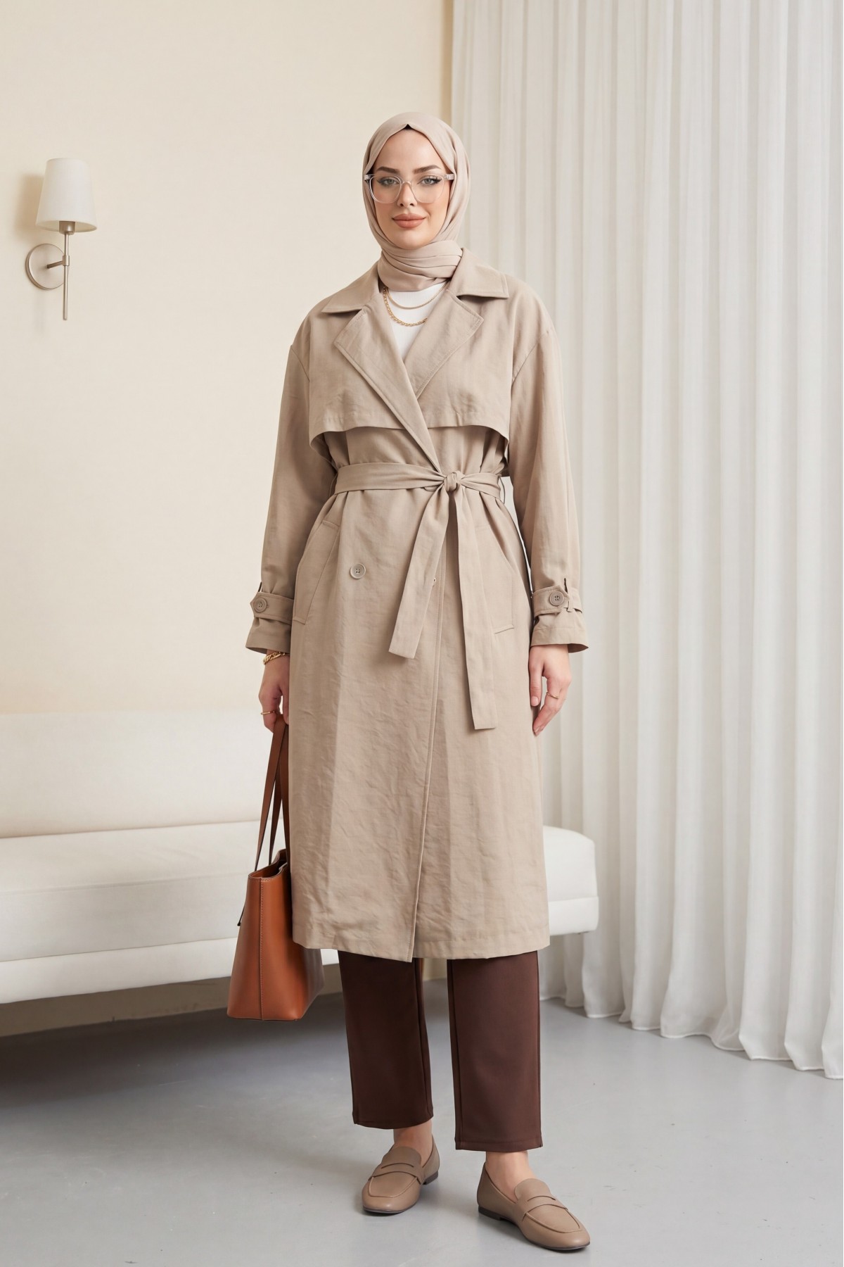 Trench coat made of polyester fabric with belt, pockets, and epauletted sleeves. -Stone